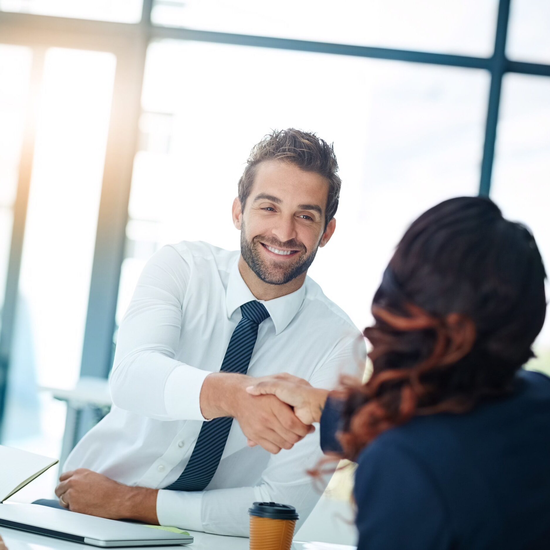 Glad you could join us for this meeting Cropped shot of businesspeople shaking hands in an office
